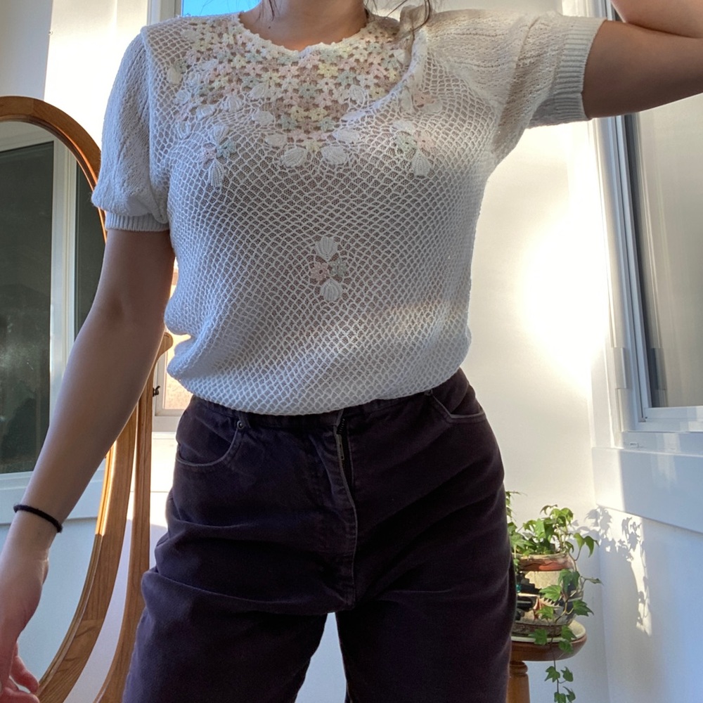 white flowery knit blouse